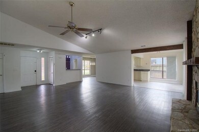 View of the wet bar, dining room, kitchen and dine
