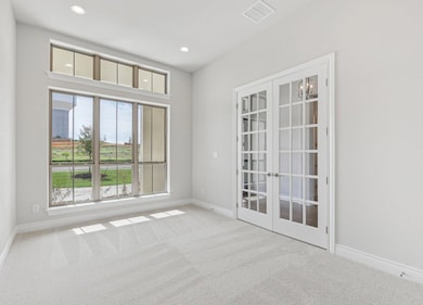 Empty room featuring baseboards, carpet flooring,