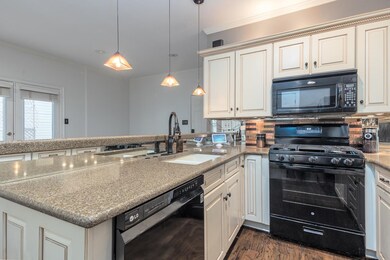 Kitchen featuring pendant lighting, backsplash, bl