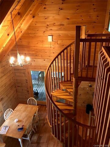A spiral staircase leads to additional sleeping ar