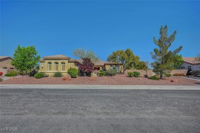 View of front of property featuring a tiled roof and stucco siding