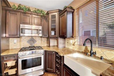 Kitchen features a farmhouse sink and a beautiful