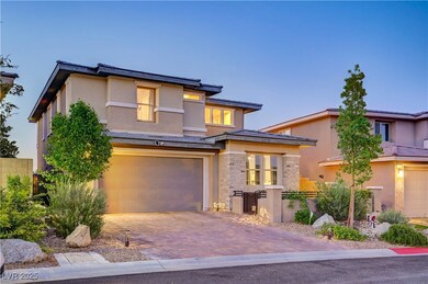 Prairie-style home featuring an attached garage, s