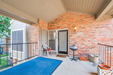 View of patio / terrace leading to front door and storage closet.