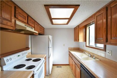 Kitchen offers ample cabinet and counter space for