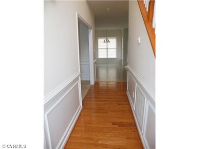 Foyer - wood floor & chair rail
