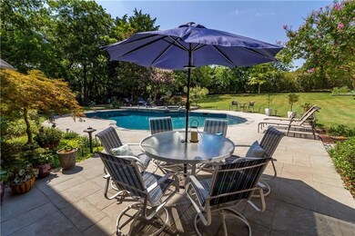 Lots of back yard sitting areas around the pool.
