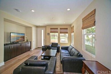 Open floor plan with modern hardwood floors is per