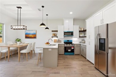 Staged. Example only. Fridge not included. Range oven and vent microwave is however included.