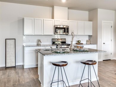 Kitchen - Wood-look flooring, granite countertops,