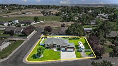 Aerial view of residential area with property parcel outlined