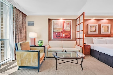 Living room featuring crown molding, recessed ligh