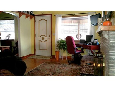 Living Room. front entrance living room with fire 