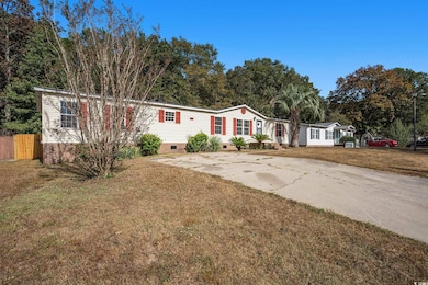 Manufactured / mobile home featuring crawl space and concrete driveway