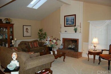 LIVING ROOM WITH VAULTED CEILINGS & FIREPLACE. SKY