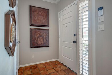 Entryway with coat closet and charming Saltillo ti