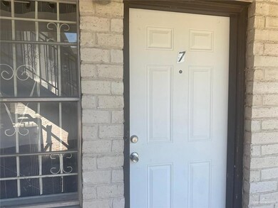 Doorway to property with brick siding