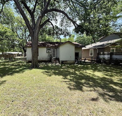 Back of property with entry steps