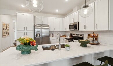 Kitchen with pendant lights over island