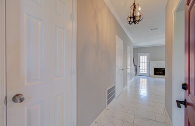This is a bright, welcoming entryway with elegant