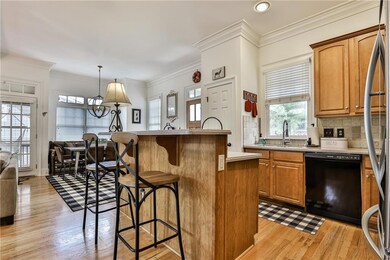 Kitchen with breakfast bar, light wood-type floori