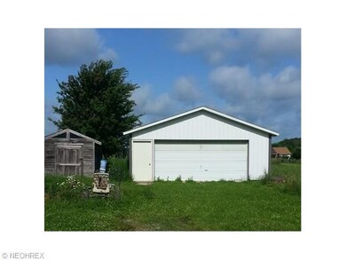 Newer two card garage with a mechanics dream 
