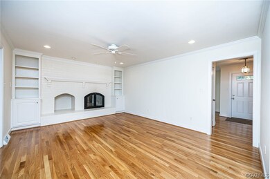 Family room featuring a wb fireplace, ceiling fan,