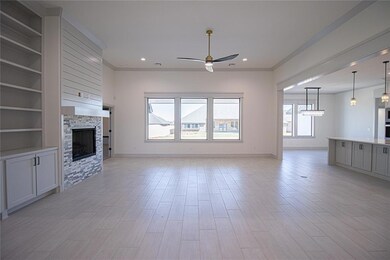 Unfurnished living room featuring built in shelves