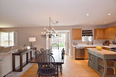 Sunny kitchen and eating area with entrance to the