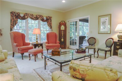 Living room view with doorway to sunroom