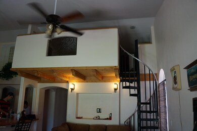 special loft area with spiral staircase