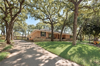 View of front of home with brick siding and driveway