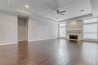 Floor-to-ceiling windows flood the room with sunlight and offer uninterrupted views of the lush fairways beyond.