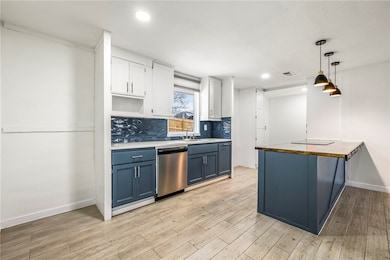 The kitchen is a stunning blend of modern elegance