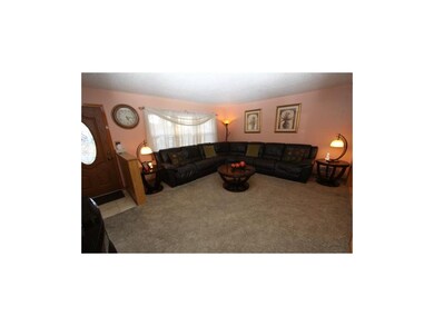 Spacious Living Room and pretty front door with st