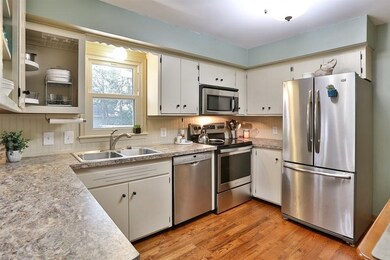 Another view of the bright and cheery kitchen.