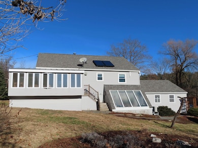 Rear view with sunroom addition