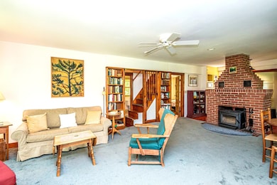 Living room with Built-ins and Warm Wood Stove
