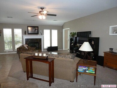 Large family room with fireplace and open to kitch