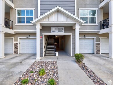 Entrance to property with an attached garage