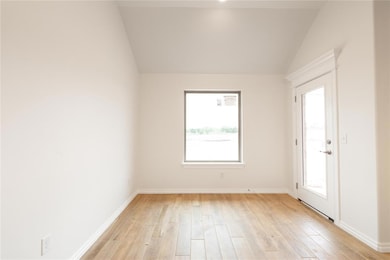 Spare room with light wood-type flooring, plenty o