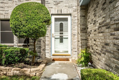 Entrance to property with brick siding