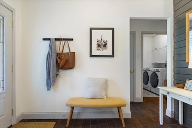 Foyer entrance featuring separate washer and drye