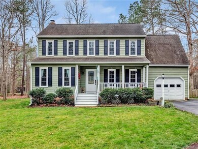 Beautiful colonial with covered front porch, paved