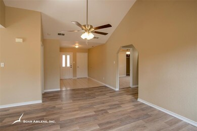 Living area with view into a bedroom