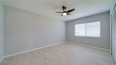 Unfurnished room featuring light wood-type flooring and ceiling fan