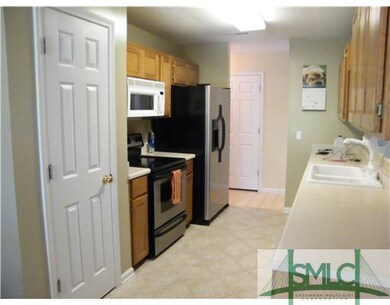 Kitchen. Galley style kitchen has stainless steel 