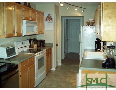 Kitchen. Bright track lighting in Kitchen area.
