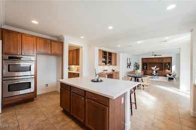 Kitchen featuring stainless steel double oven, lig