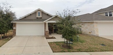 Craftsman-style home featuring brick siding, conc